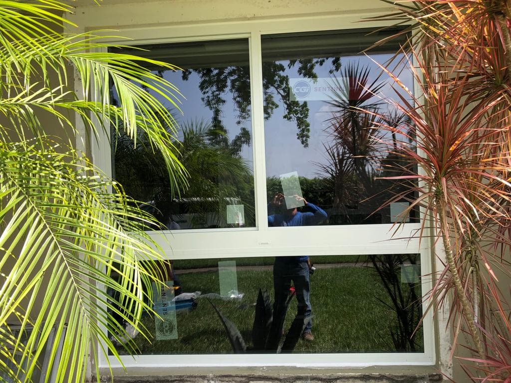 Premium aluminum frame impact windows installed in a high-rise building in Miami Florida with thermally broken frames and Low-E glass