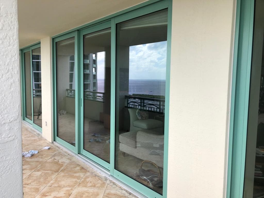 Architecturally designed impact windows installed on a historic style home in Key West Florida preserving the unique character of the property