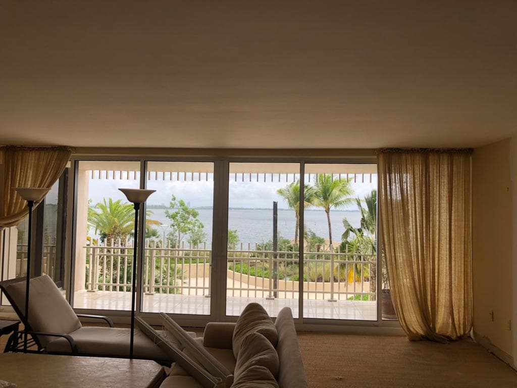 White casement style impact windows installed on a modern home in Boca Raton Florida with crank-out operation and multi-point locks