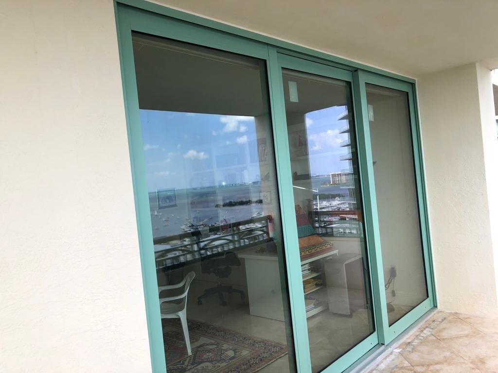 Hurricane impact bathroom window installed during a renovation in Miami Florida with frosted laminated glass providing privacy and storm protection