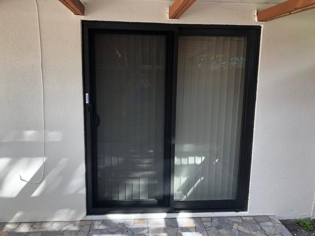 Before and after comparison showing impact window replacement transformation on a Florida home with improved aesthetics and hurricane protection