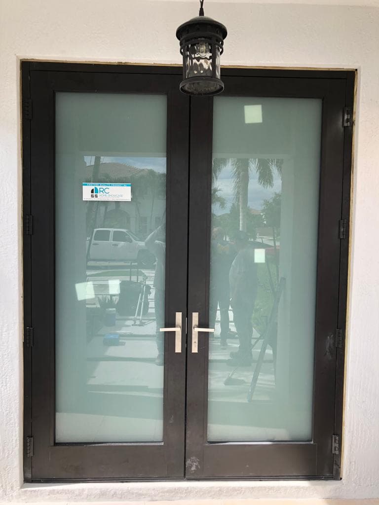 Installation photo showing flashing and water barrier around impact window frame on a Florida home ensuring waterproof seal